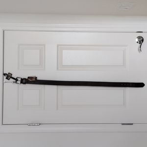 Genuine Harley-Davidson brown leather belt with buckle, size 34. Tooled leather.